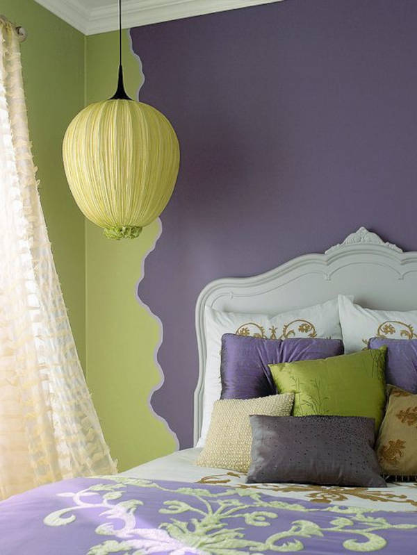A bedroom painited with the complementary colour palette - green and purple.